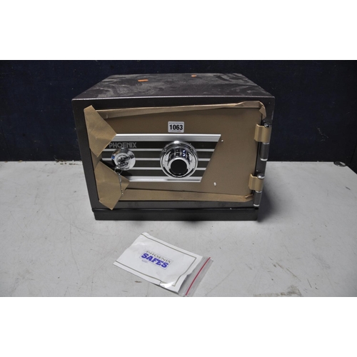 1063 - A PHEONIX SAFE model No unknown with two keys and code (in new unused condition)