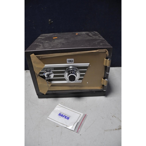 1063 - A PHEONIX SAFE model No unknown with two keys and code (in new unused condition)