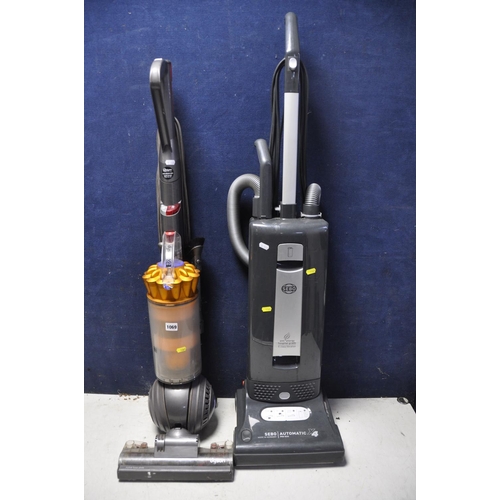 1069 - A DYSON DC40 UPRIGHT VACUUM along with Sebo 90573GB X4 pro upright vacuum (both PAT pass and working... 