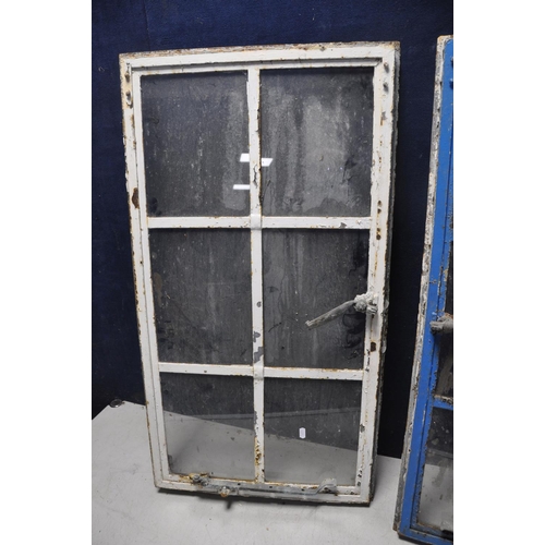 1097 - A PAIR OF EARLY 20TH CENTURY METAL FRAMED WINDOW INSERTS measuring width 51cm x height 94cm