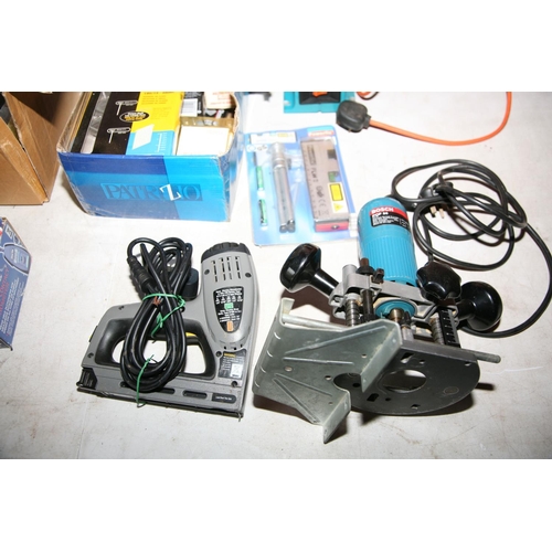 1143 - A BOSCH POF 50 ROUTER, a Duratool heat gun, a Black and Decker Bench Grinder, a Stanley electric Sta... 