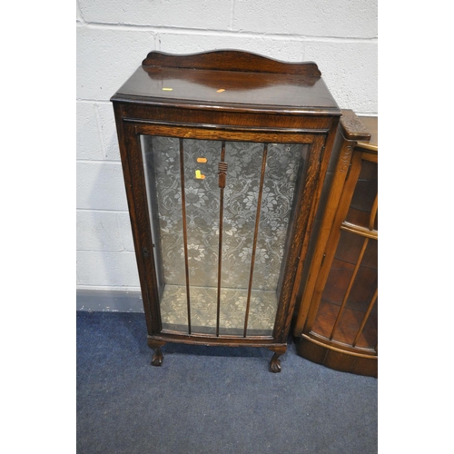 1205 - A 20TH CENTURY OAK SIDE BY SIDE BUREAU BOOKCASE, two glazed doors flanking a fall front door, above ... 