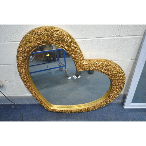 1233 - A LARGE SELECTION OF MIRRORS, to include a heart shaped gilt mirror, with rose bud decoration, width... 