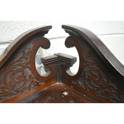 1237 - AN EDWARDIAN MAHOGANY CORNER CUPBOARD, with foliate and scrolled pediment, two beveled mirrors, abov... 