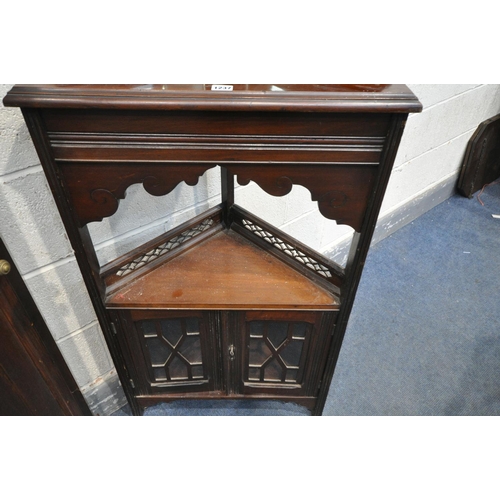 1237 - AN EDWARDIAN MAHOGANY CORNER CUPBOARD, with foliate and scrolled pediment, two beveled mirrors, abov... 