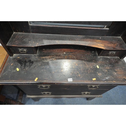 1238 - A 20TH CENTURY OAK DRESSING CHEST, with a single swing mirror and two drawers, over two short and on... 