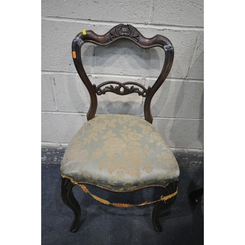 1242 - A VICTORIAN WALNUT BUTTONED SPOON BACK OPEN ARMCHAIR, with green floral upholstery, on carved front ... 