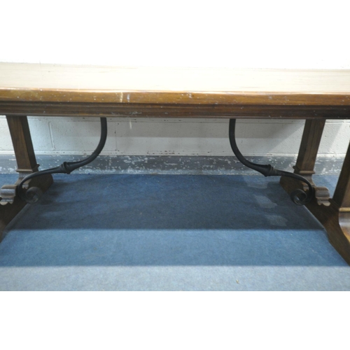 1245 - A REFECTORY STYLE ELM EFFECT DINING TABLE, on trestle legs, with wrought iron stretchers, length 241... 