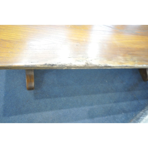 1245 - A REFECTORY STYLE ELM EFFECT DINING TABLE, on trestle legs, with wrought iron stretchers, length 241... 