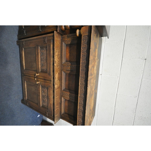 1252 - A 20TH CENTURY OAK COURT CUPBOARD, a single door above two drawers and two cupboard doors, length 12... 