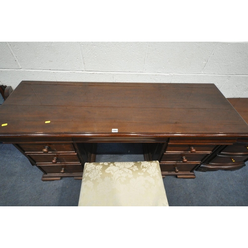 1263 - A MAHOGANY DRESSING DESK, with a triple beveled mirror, and an assortment of nine drawers, width 150... 