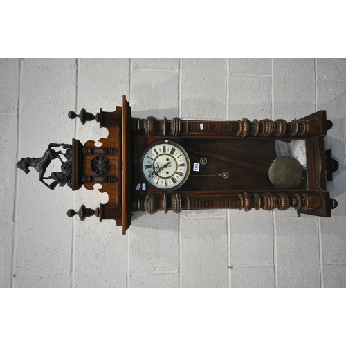 1275 - A 19TH CENTURY WALNUT CASED EIGHT DAY GUSTAV BECKER WALL CLOCK, the pediment depicting  horse, two f... 