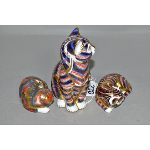 336 - THREE ROYAL CROWN DERBY PAPERWEIGHTS, comprising Cat, a second with silver stopper, a Catnip Kitten,... 