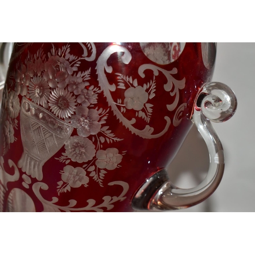 355 - A LATE 19TH CENTURY BOHEMIAN GLASS TWIN HANDLED BALUSTER VASE, ruby stained and cut to clear with fa... 