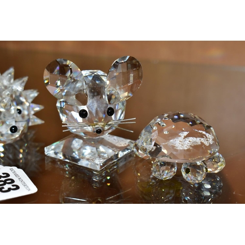 383 - THREE SWAROVSKI CRYSTAL ANIMALS AND A PUFFER FISH, the animals comprising a hedgehog, length 7cm, a ... 