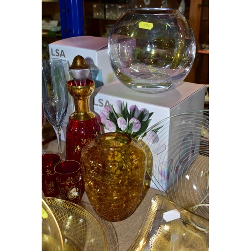 421 - A QUANTITY OF CUT CRYSTAL AND COLOURED GLASSWARE, comprising three large fruit bowls (one has nibble... 