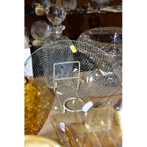 421 - A QUANTITY OF CUT CRYSTAL AND COLOURED GLASSWARE, comprising three large fruit bowls (one has nibble... 