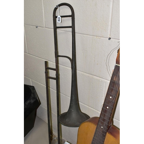 516 - AN E.F. ALLEN & SONS TROMBONE MISSING THE MOUTHPIECE AND A GERMAN ACOUSTIC GUITAR, both instruments ... 