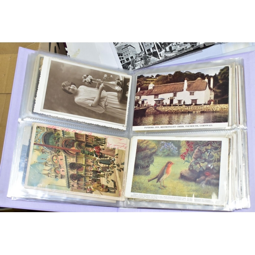 519 - POSTCARDS, three albums containing approximately 420 postcards and photographs dating from the early... 