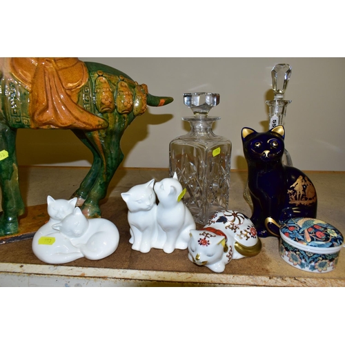 553 - A GROUP OF CERAMIC CAT FIGURES AND CUT GLASS DECANTERS, comprising a large reproduction Tang Dynasty... 