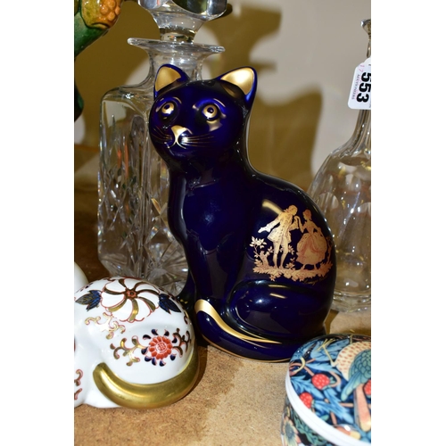 553 - A GROUP OF CERAMIC CAT FIGURES AND CUT GLASS DECANTERS, comprising a large reproduction Tang Dynasty... 