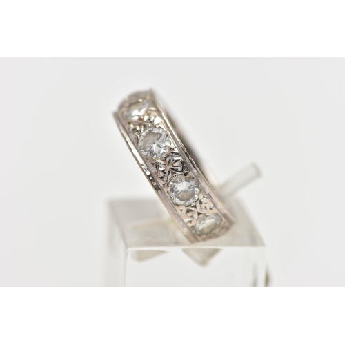 110 - A WHITE METAL DIAMOND FULL ETERNITY RING, comprising a series of brilliant cut diamonds with texture... 