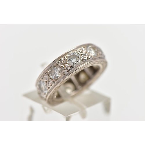 110 - A WHITE METAL DIAMOND FULL ETERNITY RING, comprising a series of brilliant cut diamonds with texture... 