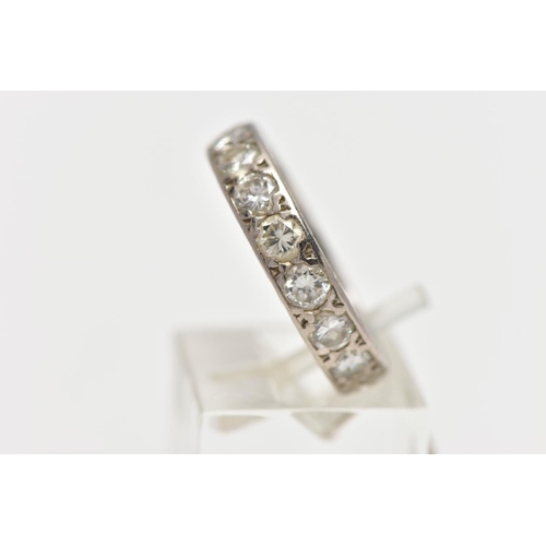 111 - A DIAMOND ETERNITY BAND RING, a full eternity ring set with nineteen round brilliant cut diamonds, a... 