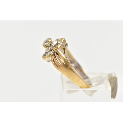 21 - A MODERN YELLOW METAL DIAMOND CLUSTER RING, set with a principal round brilliant cut diamond, within... 