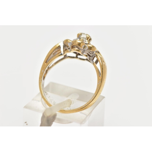 21 - A MODERN YELLOW METAL DIAMOND CLUSTER RING, set with a principal round brilliant cut diamond, within... 