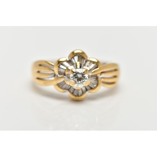 21 - A MODERN YELLOW METAL DIAMOND CLUSTER RING, set with a principal round brilliant cut diamond, within... 