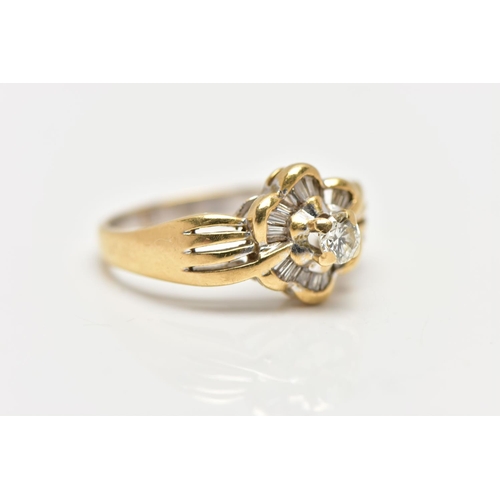 21 - A MODERN YELLOW METAL DIAMOND CLUSTER RING, set with a principal round brilliant cut diamond, within... 