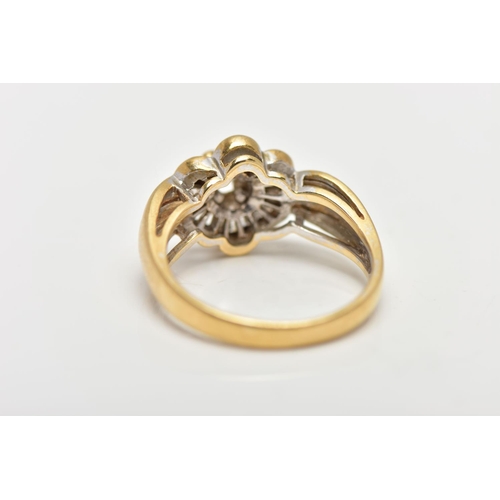 21 - A MODERN YELLOW METAL DIAMOND CLUSTER RING, set with a principal round brilliant cut diamond, within... 