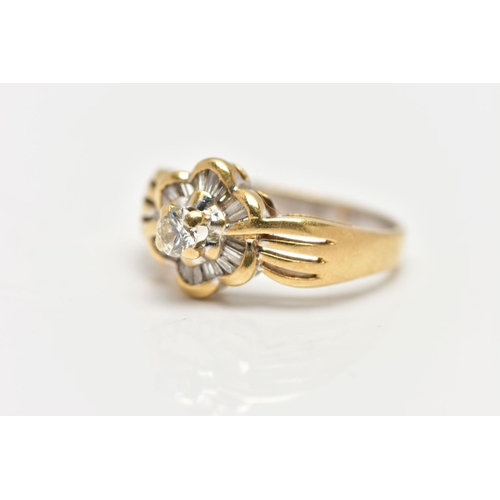 21 - A MODERN YELLOW METAL DIAMOND CLUSTER RING, set with a principal round brilliant cut diamond, within... 