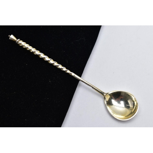 23 - A WHITE METAL CONDIMENT SPOON, twisted handle, engraved floral detail to the reverse of the bowl, st... 