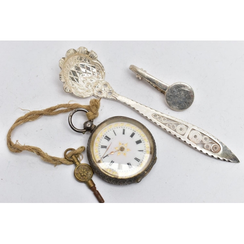 46 - A SILVER NAPKIN CLIP, POCKET WATCH AND SPOON, the first a silver napkin clip, hallmarked 'Hugh Craws... 