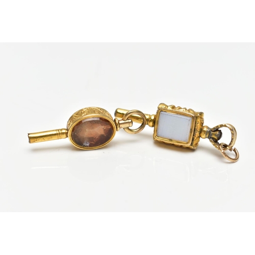 51 - TWO WATCH KEYS, the first a yellow metal key set with an oval citrine and chalcedony panels, floral ... 