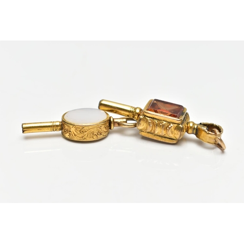 51 - TWO WATCH KEYS, the first a yellow metal key set with an oval citrine and chalcedony panels, floral ... 