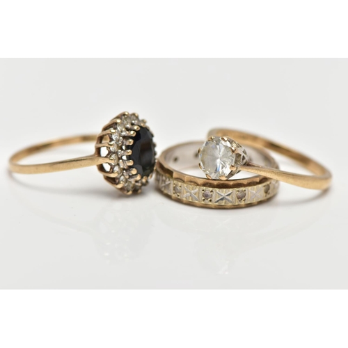 6 - TWO 9CT GOLD RINGS AND A YELLOW AND WHITE METAL RING, the first an oval cut sapphire set with a clus... 