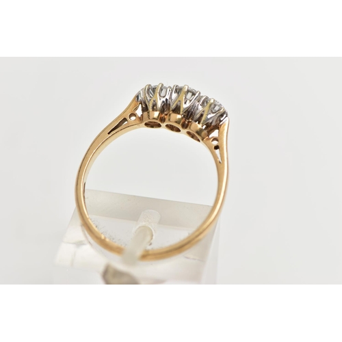 62 - A 9CT YELLOW GOLD THREE STONE DIAMOND RING, designed with three claw set, round brilliant cut diamon... 