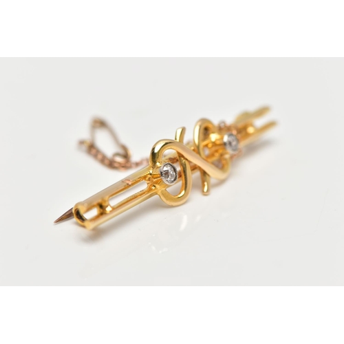 63 - A YELLOW METAL DIAMOND SET BAR BROOCH, double polished bar with a central twist design flanked with ... 