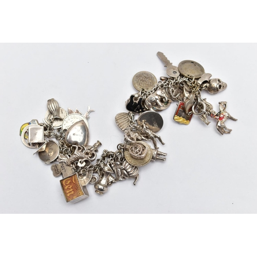 70 - A WHITE METAL CHARM BRACELET, curb link chain fitted with fifty-two charms in form such as a teapot,... 