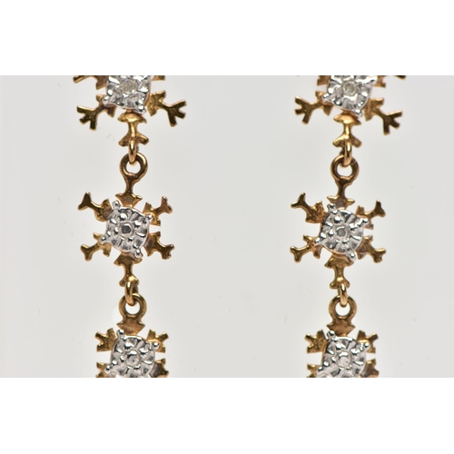 72 - A PAIR OF 9CT YELLOW GOLD DROP EARRINGS, each designed with three graduating snowflakes, the top sno... 