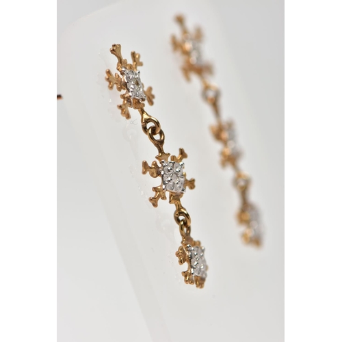 72 - A PAIR OF 9CT YELLOW GOLD DROP EARRINGS, each designed with three graduating snowflakes, the top sno... 