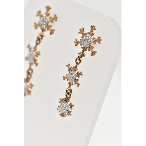 72 - A PAIR OF 9CT YELLOW GOLD DROP EARRINGS, each designed with three graduating snowflakes, the top sno... 