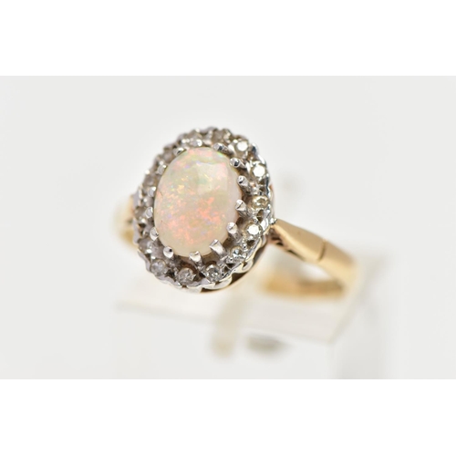 73 - A 9CT GOLD OPAL AND DIAMOND CLUSTER RING, centering on an oval opal cabochon in a claw setting, with... 