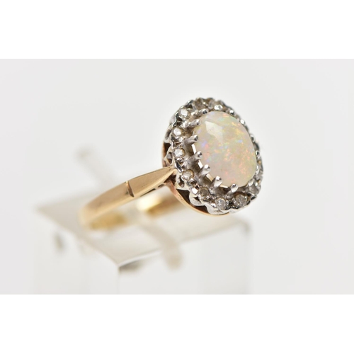 73 - A 9CT GOLD OPAL AND DIAMOND CLUSTER RING, centering on an oval opal cabochon in a claw setting, with... 