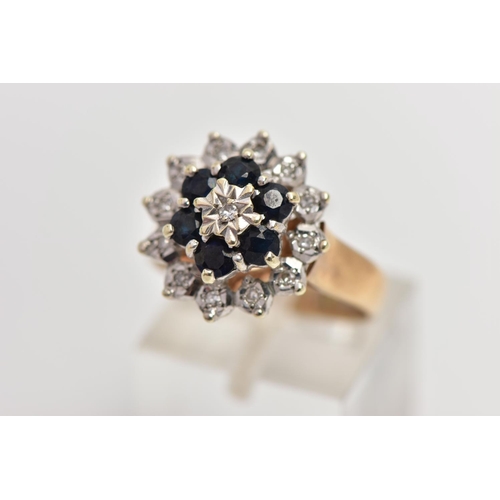 74 - A 9CT GOLD SAPPHIRE AND DIAMOND CLUSTER RING, raised circular cluster, centering on a single cut dia... 