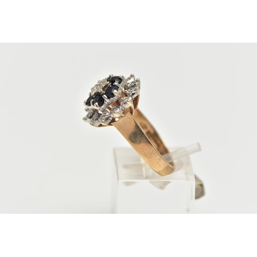 74 - A 9CT GOLD SAPPHIRE AND DIAMOND CLUSTER RING, raised circular cluster, centering on a single cut dia... 