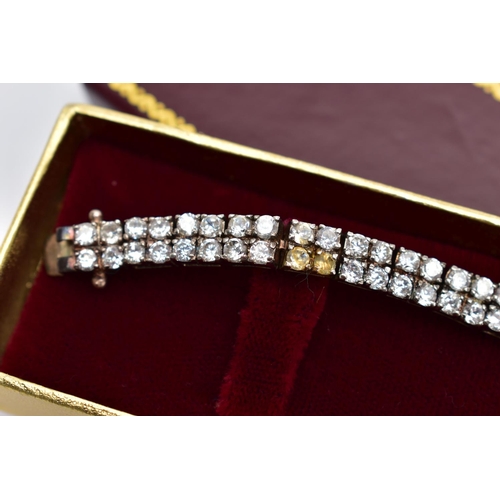 78 - A SILVER CUBIC ZIRCONIA LINE BRACELET AND A SILVER BAR, the bracelet designed with two lines of circ... 